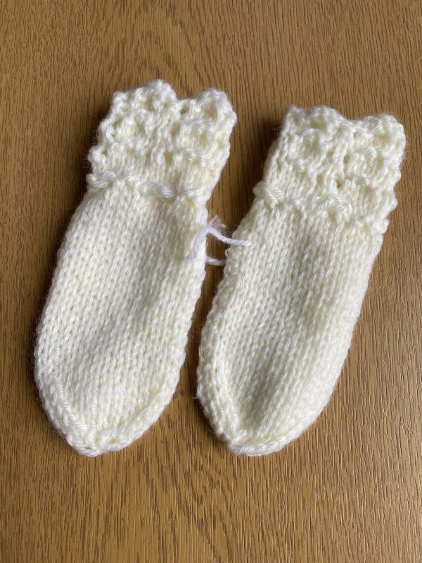 Hand-knitted baby mittens